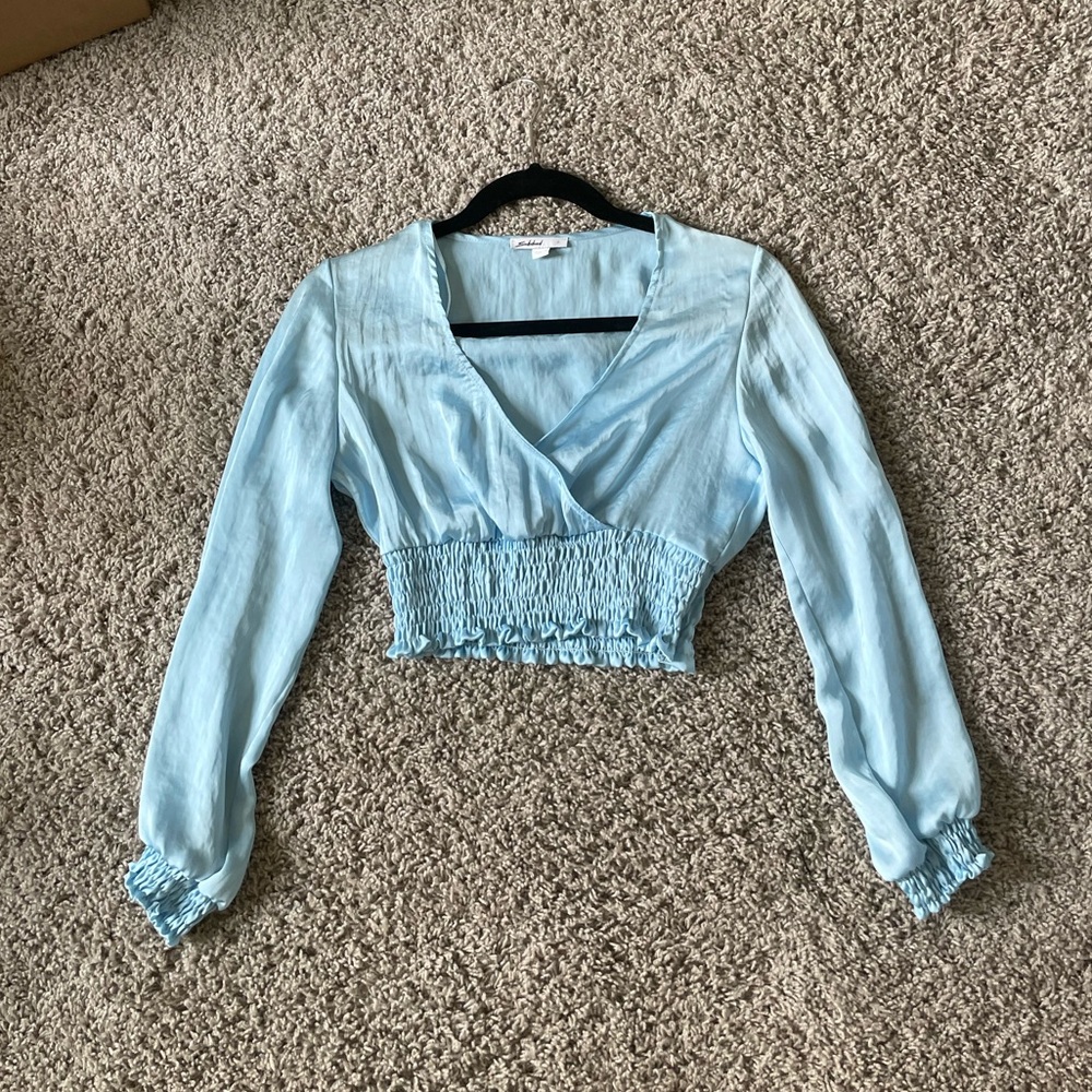 Subdued blue silk blouse